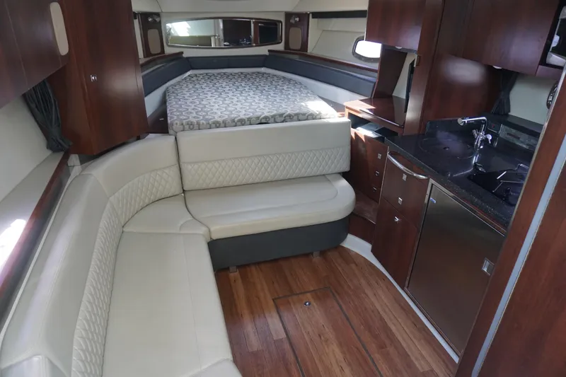 Slide: The Image of Luxurious interior of 2014 Chaparral 330 Signature yacht with cozy seating and kitchenette. - 27