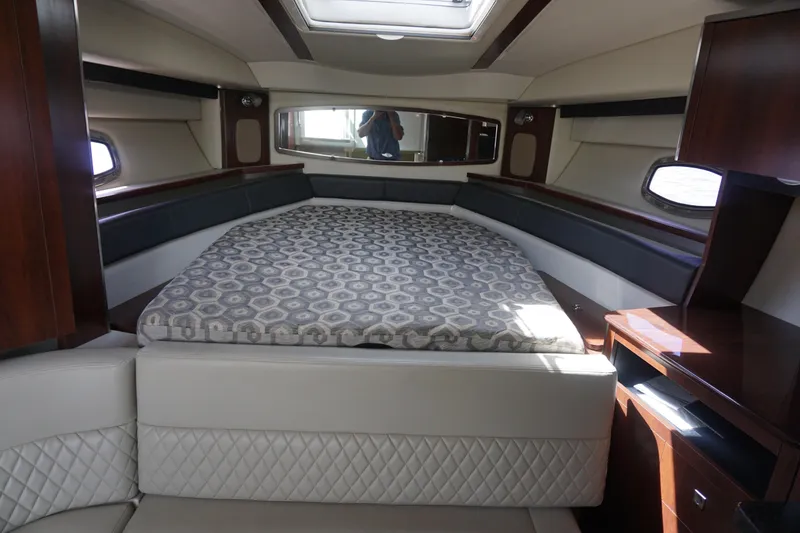 Slide: The Image of Luxurious interior cabin of 2014 Chaparral 330 Signature yacht with elegant bedding. - 28