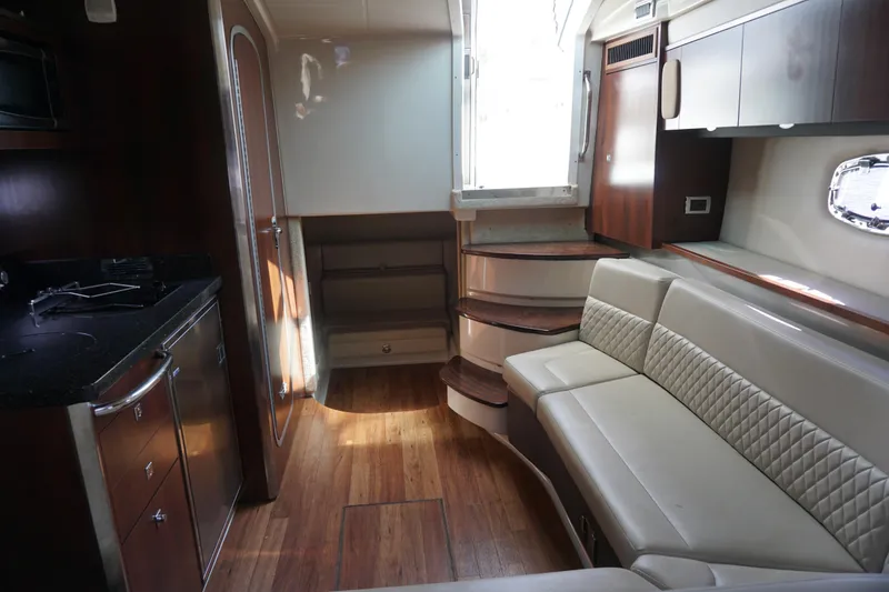 Slide: The Image of Interior of 2014 Chaparral 330 Signature yacht with modern kitchen and seating area. - 31