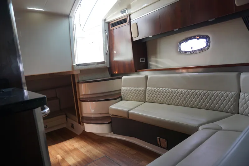 Slide: The Image of Luxurious interior of 2014 Chaparral 330 Signature yacht with elegant seating and wood accents. - 33