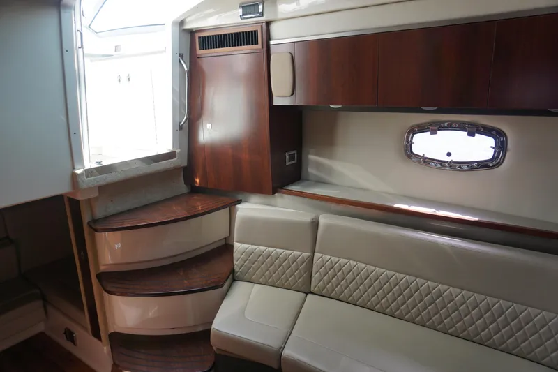 Slide: The Image of Interior of 2014 Chaparral 330 Signature yacht with elegant seating and wooden cabinetry. - 39