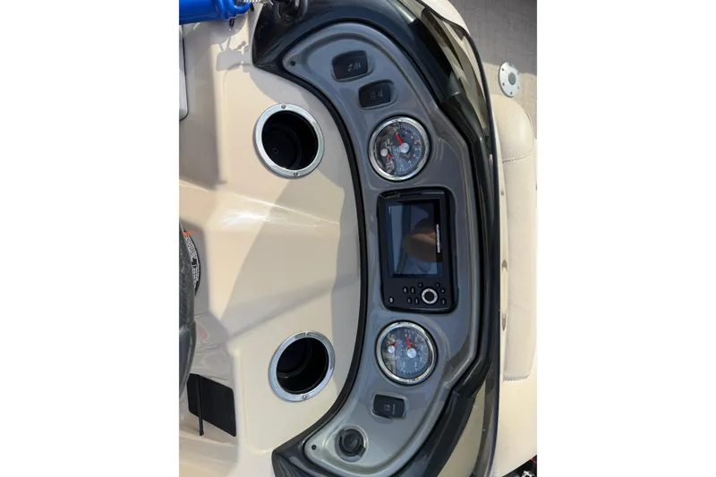 Slide: The Image of Dashboard of 2019 Sun Tracker SportFish 22 DLX boat with gauges and controls. - 19