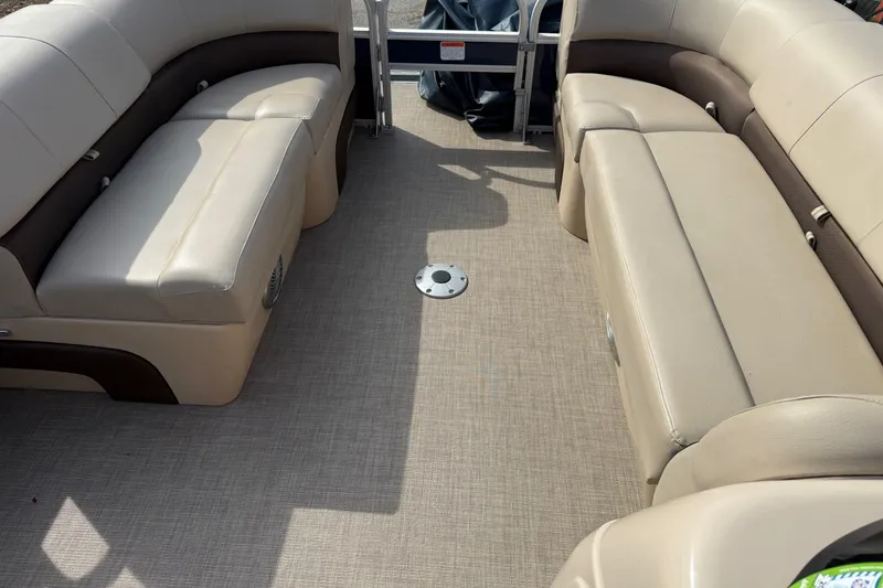 Slide: The Image of Interior of 2019 Sun Tracker SportFish 22 DLX with beige seating and carpeted floor. - 20