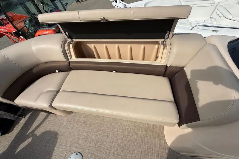 Slide: The Image of 2019 Sun Tracker SportFish 22 DLX boat seat with open storage compartment. - 23