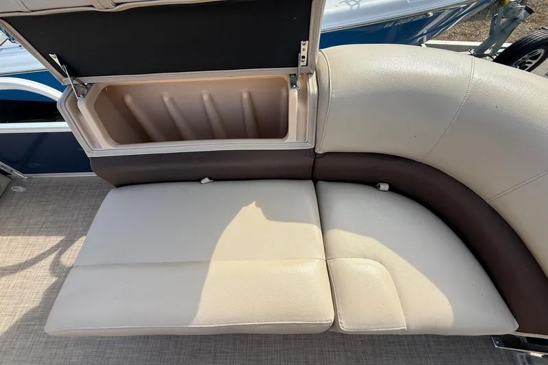 Slide: The Image of 2019 Sun Tracker SportFish 22 DLX boat seat with open storage compartment. - 24