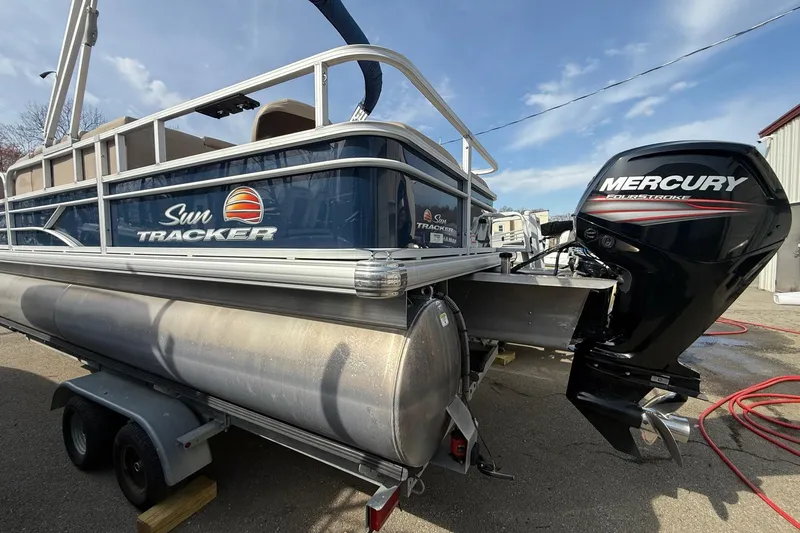 Slide: The Image of 2019 Sun Tracker SportFish 22 DLX pontoon boat with Mercury outboard motor. - 3