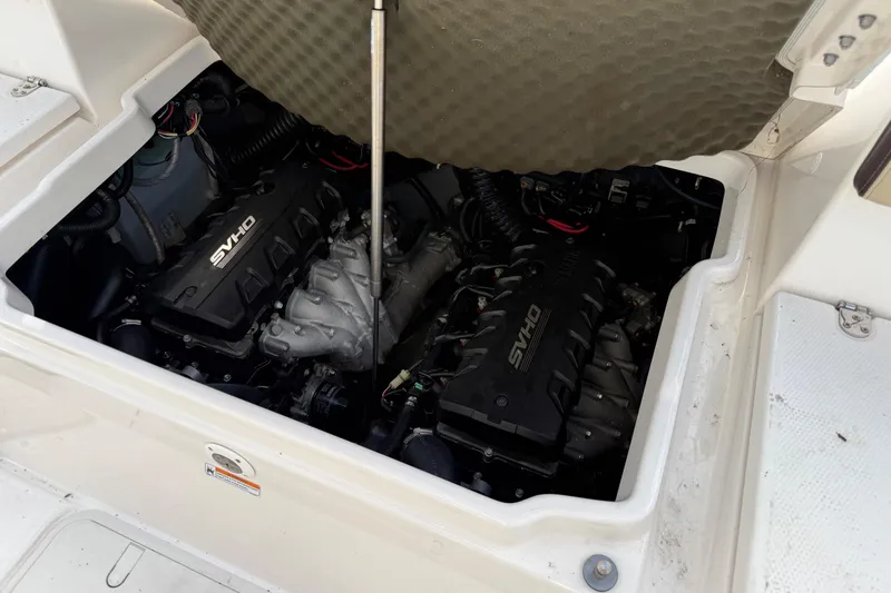 Slide: The Image of 2021 Yamaha Boats 255 FSH Sport E engine compartment with twin SVHO engines. - 11