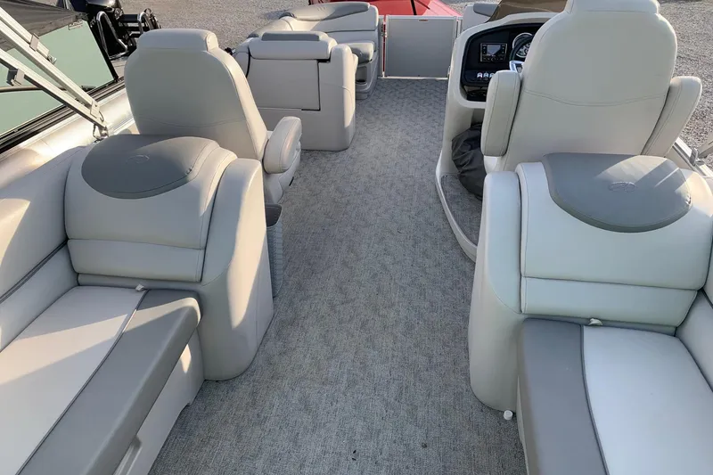 Slide: The Image of 2018 Avalon 2585 Catalina Quad Lounger interior with plush seating and modern dashboard. - 14