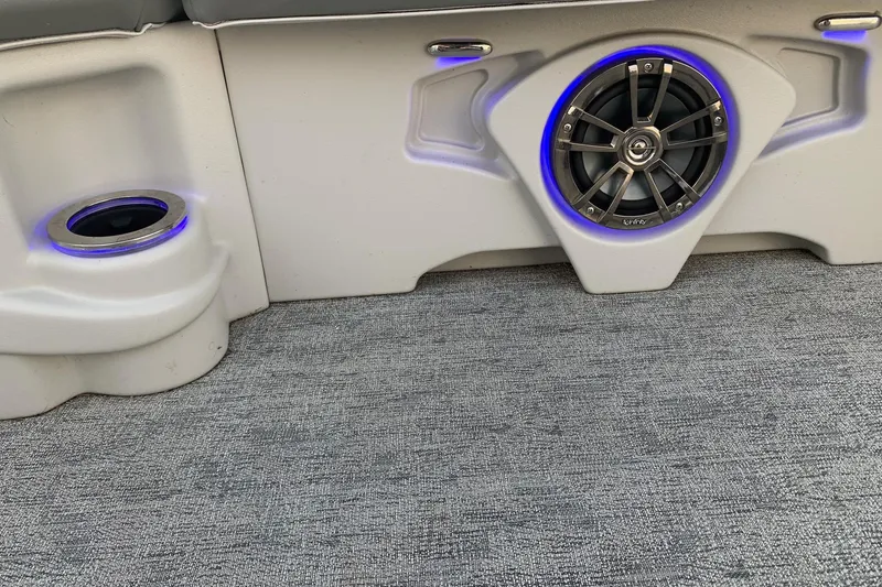 Slide: The Image of 2018 Avalon 2585 Catalina Quad Lounger interior with speaker and cup holder, blue LED lighting. - 17