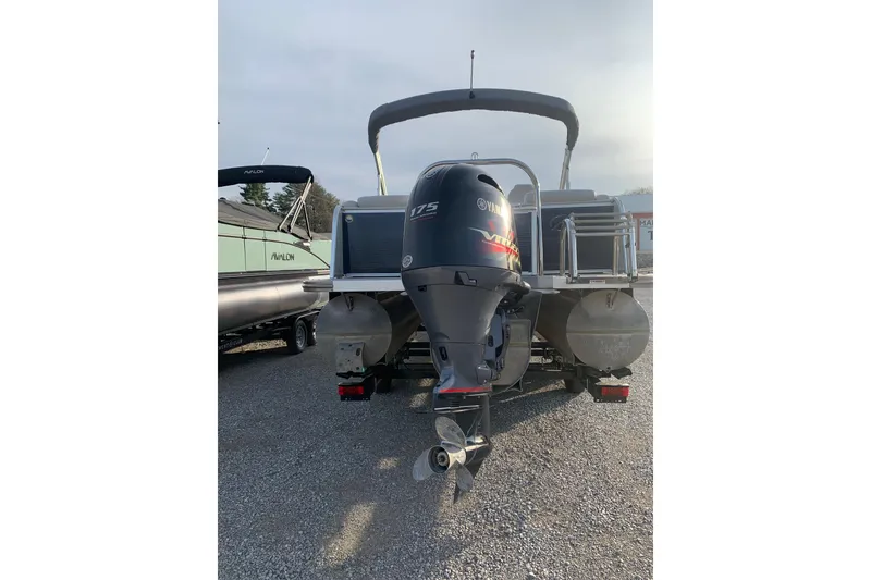 Slide: The Image of 2018 Avalon 2585 Catalina Quad Lounger with Yamaha 175 engine, parked on gravel. - 3