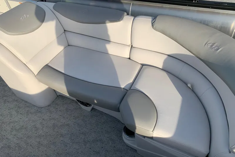 Slide: The Image of 2018 Avalon 2585 Catalina Quad Lounger with plush gray seating and cup holders. - 5