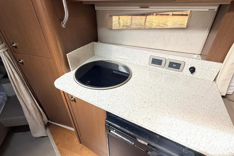 Slide: The Image of Interior of 2013 Sea Ray 370 Venture yacht with sofa, TV, and modern lighting. - 18