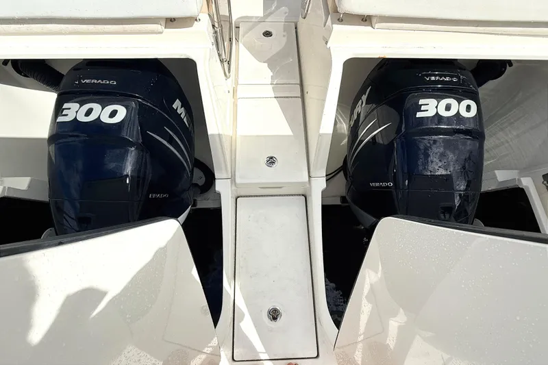 Slide: The Image of Twin Mercury Verado 300 engines on a 2013 Sea Ray 370 Venture boat. - 23