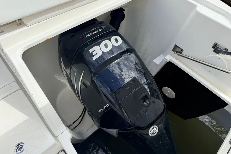 Slide: The Image of 2013 Sea Ray 370 Venture with 300 Verado outboard engine in compartment. - 26