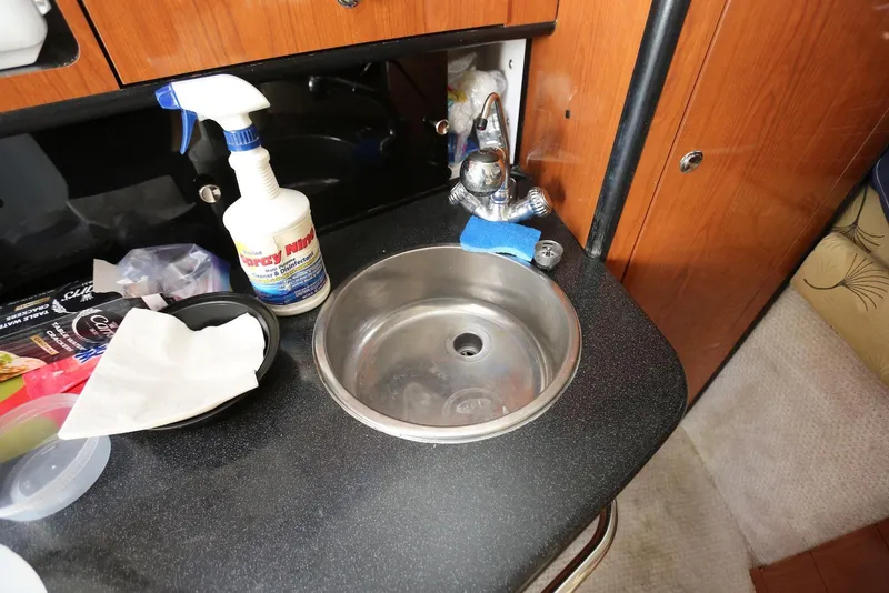 Slide: The Image of Small sink area in a 2000 Chaparral Signature 300 boat cabin. - 16