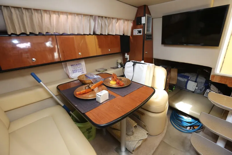 Slide: The Image of Interior of 2000 Chaparral Signature 300 yacht with dining area and modern amenities. - 23