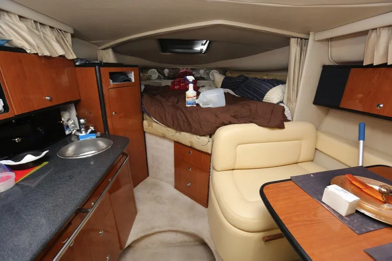 Slide: The Image of Interior of 2000 Chaparral Signature 300 boat with kitchenette and cozy sleeping area. - 24