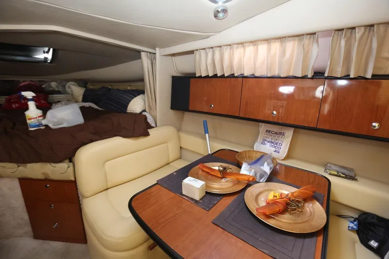 Slide: The Image of Interior of 2000 Chaparral Signature 300 boat with dining area and cozy sleeping space. - 25