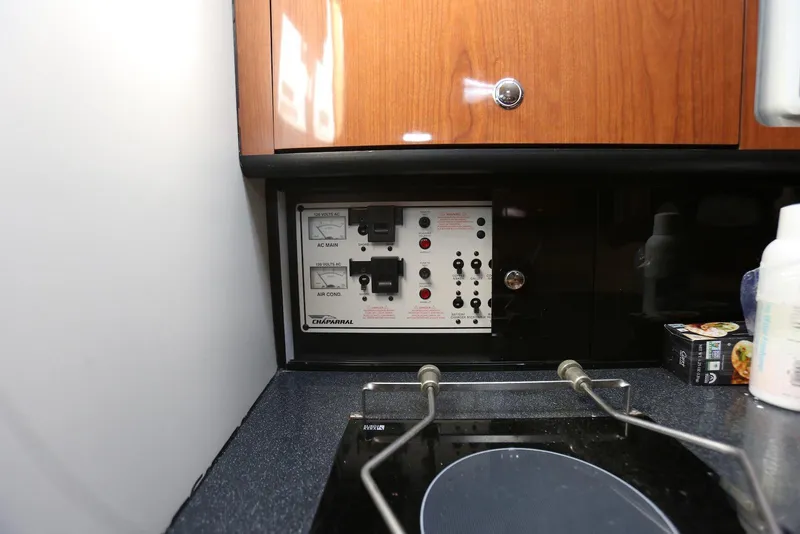 Slide: The Image of Electrical control panel in a 2000 Chaparral Signature 300 boat interior. - 28