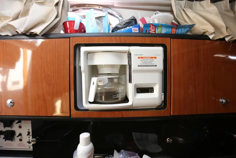 Slide: The Image of Built-in coffee maker in 2000 Chaparral Signature 300 boat interior. - 34