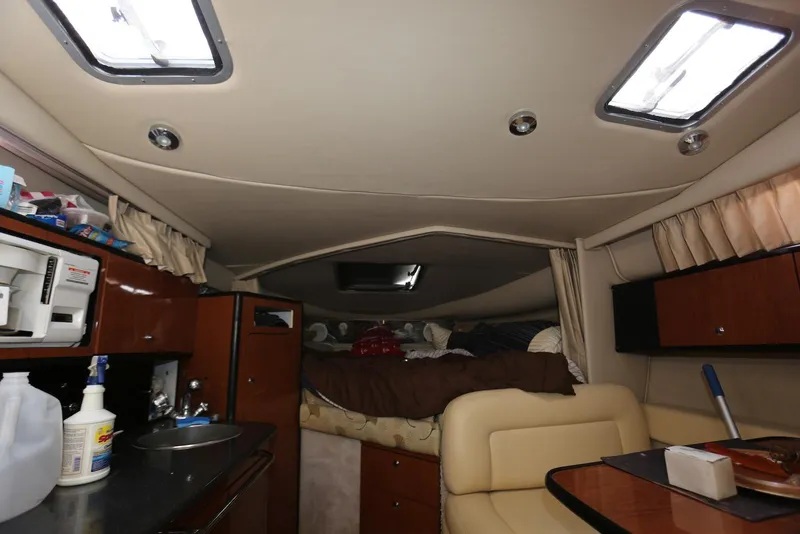 Slide: The Image of Interior of 2000 Chaparral Signature 300 boat with kitchenette and sleeping area. - 39