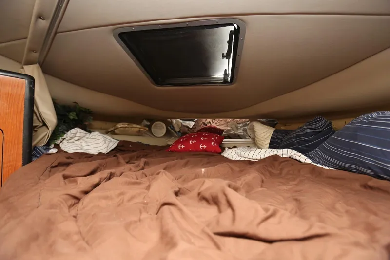 Slide: The Image of Cozy cabin interior of 2000 Chaparral Signature 300 boat with bedding and skylight. - 40