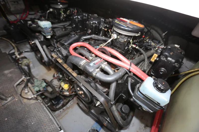 Slide: The Image of Engine compartment of a 2000 Chaparral Signature 300 boat, showcasing mechanical components. - 43