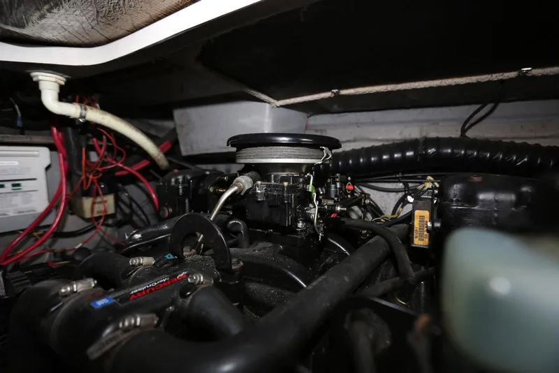 Slide: The Image of Engine compartment of a 2000 Chaparral Signature 300 boat, showcasing wiring and components. - 50