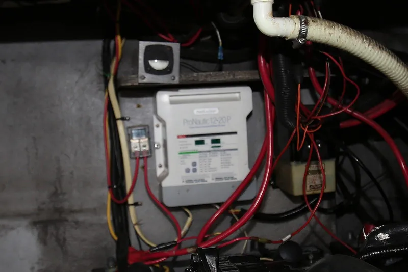 Slide: The Image of Electrical wiring and components inside a 2000 Chaparral Signature 300 boat. - 51