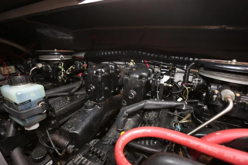 Slide: The Image of Engine compartment of a 2000 Chaparral Signature 300 boat, showcasing mechanical components. - 56