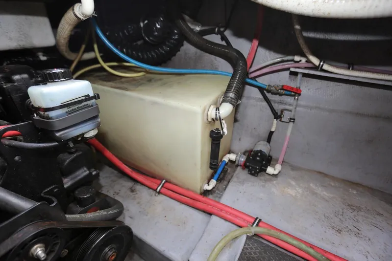 Slide: The Image of Engine compartment of a 2000 Chaparral Signature 300 boat, featuring wiring and a fire extinguisher. - 60