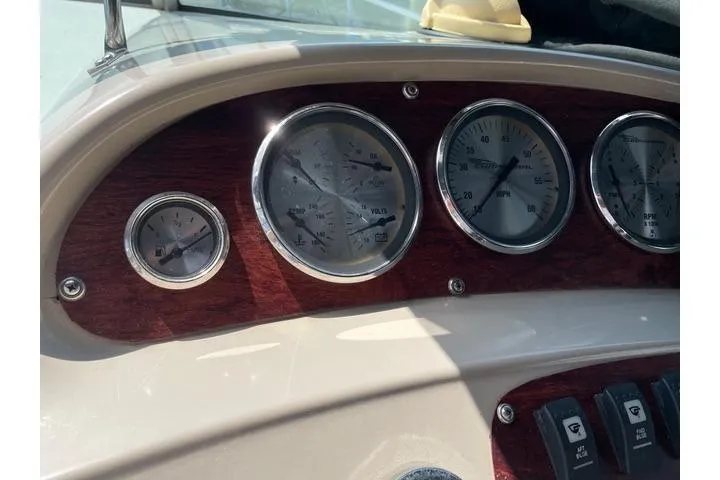 Slide: The Image of Dashboard of a 2000 Chaparral Signature 300 boat with gauges and switches. - 7