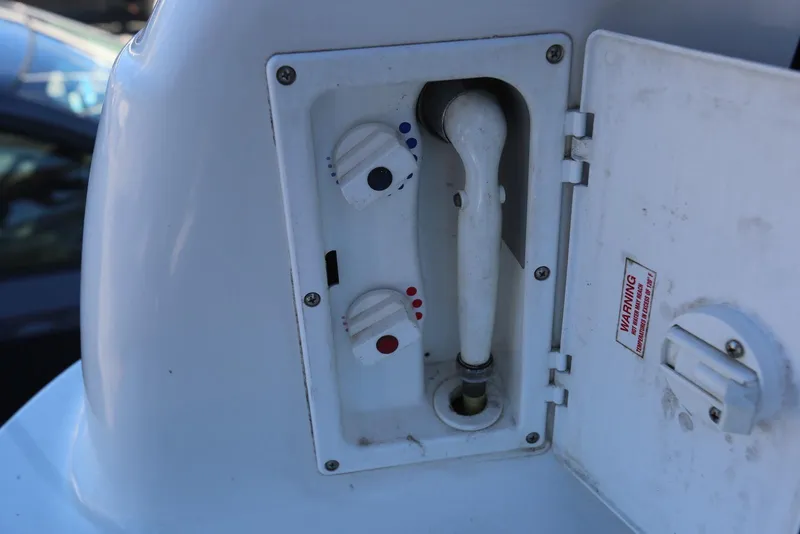 Slide: The Image of Outdoor shower controls on a 2000 Chaparral Signature 300 boat. - 74