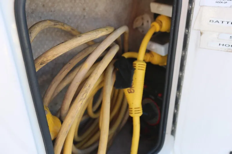 Slide: The Image of Electrical cables in storage compartment of 2000 Chaparral Signature 300 boat. - 75