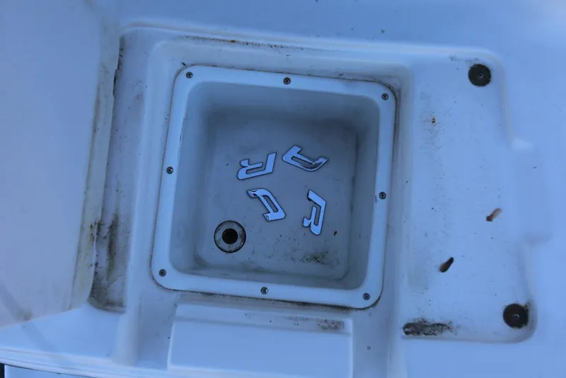 Slide: The Image of Boat compartment with scattered letters, Chaparral Signature 300, 2000 model. - 76