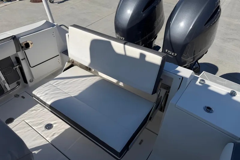 Slide: The Image of 2020 Blackfin 242 CC boat with dual Yamaha 150 engines and cushioned seating. - 30