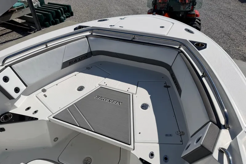 Slide: The Image of 2020 Blackfin 242 CC boat interior with seating and storage compartments. - 37
