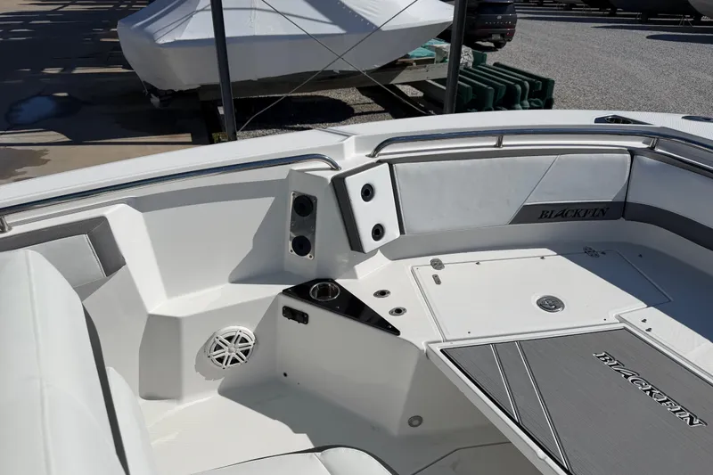 Slide: The Image of 2020 Blackfin 242 CC boat interior with seating and speaker system. - 38