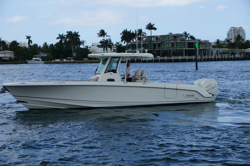 Slide: The Image of 2018 Boston Whaler 330 Outrage boat cruising on a scenic waterway. - 3