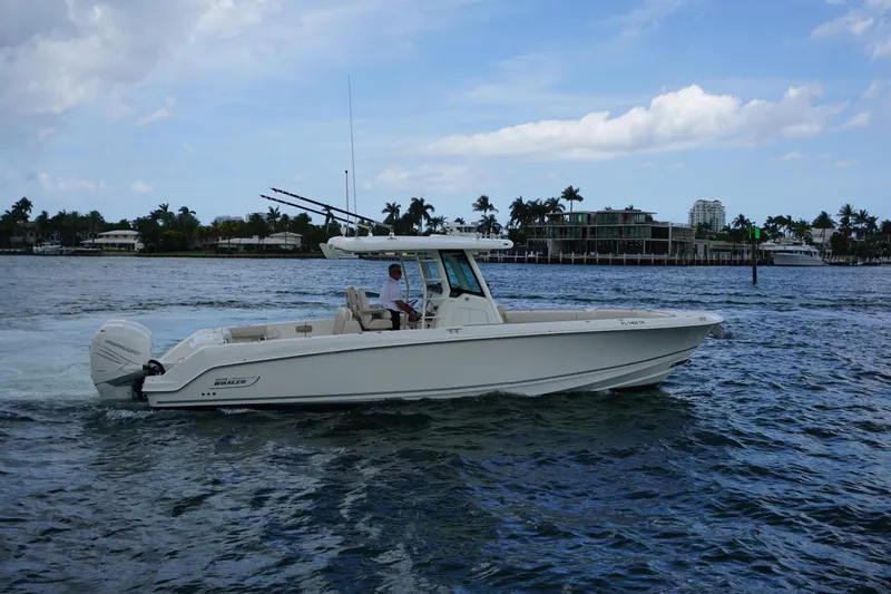 Slide: The Image of 2018 Boston Whaler 330 Outrage cruising on a scenic waterway. - 5