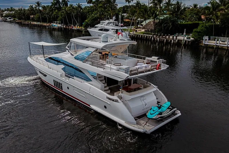 Slide: The Image of Luxurious 2017 Azimut 80 yacht cruising on a scenic waterway with lush surroundings. - 104