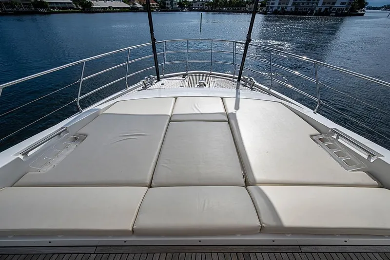 Slide: The Image of Luxurious sunbathing deck on a 2017 Azimut 80 yacht, overlooking serene waters. - 11