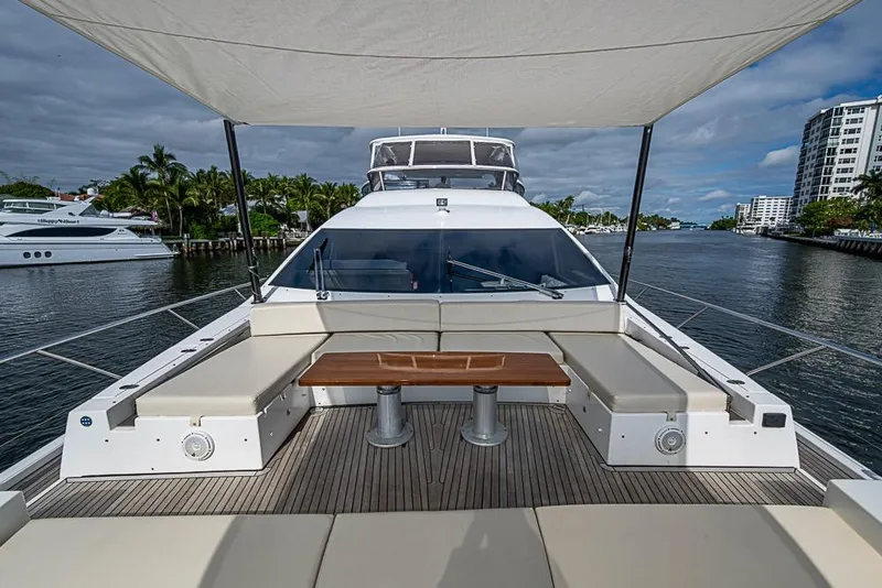 Slide: The Image of Luxurious 2017 Azimut 80 yacht deck with seating, docked by waterfront buildings. - 12