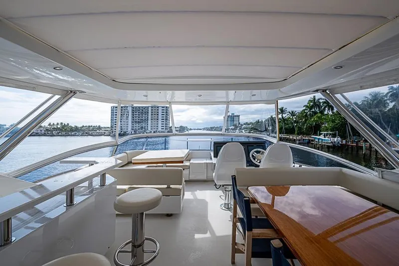 Slide: The Image of Luxurious 2017 Azimut 80 yacht interior with elegant seating and scenic waterfront view. - 23