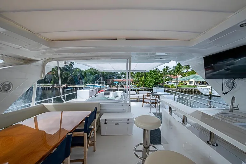 Slide: The Image of Luxurious 2017 Azimut 80 yacht interior with seating, bar, and waterfront view. - 27