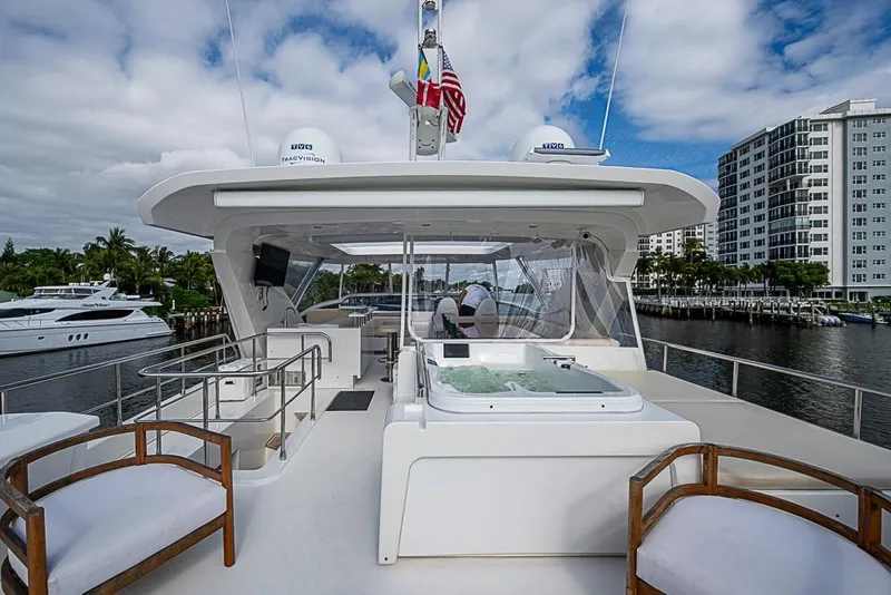 Slide: The Image of Luxurious 2017 Azimut 80 yacht with jacuzzi, docked near waterfront buildings. - 31