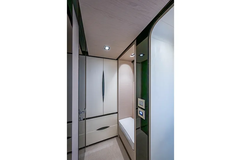 Slide: The Image of Luxurious interior of 2017 Azimut 80 yacht, featuring sleek cabinetry and modern lighting. - 69