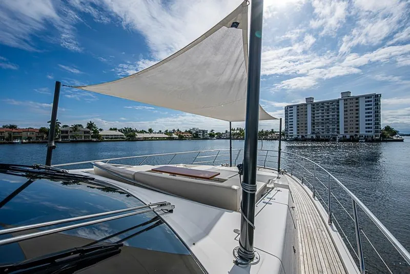 Slide: The Image of Luxury Azimut 80 yacht deck with sunshade, 2017 model, on a sunny waterfront. - 7