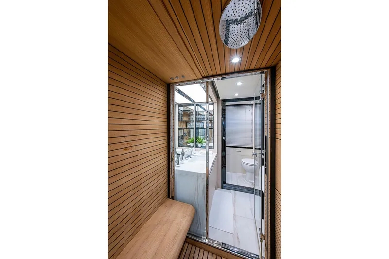 Slide: The Image of Luxurious bathroom interior on 2017 Azimut 80 yacht, featuring wood paneling and modern fixtures. - 71