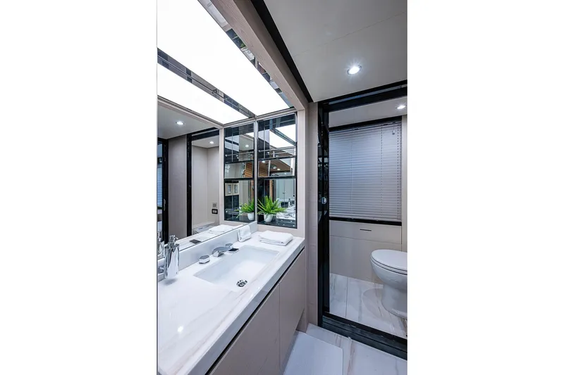 Slide: The Image of Luxurious bathroom interior on 2017 Azimut 80 yacht, featuring modern fixtures and elegant design. - 72